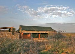 One of the four fully equipped spacious tents with the ablution block built in sandstone to the rear. The verandas have a view over the Lake.